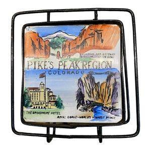 Vintage 1950s souvenir metal and ceramic napkin holder. Vintage condition